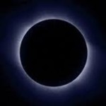 new moon surrounded by ring of light
